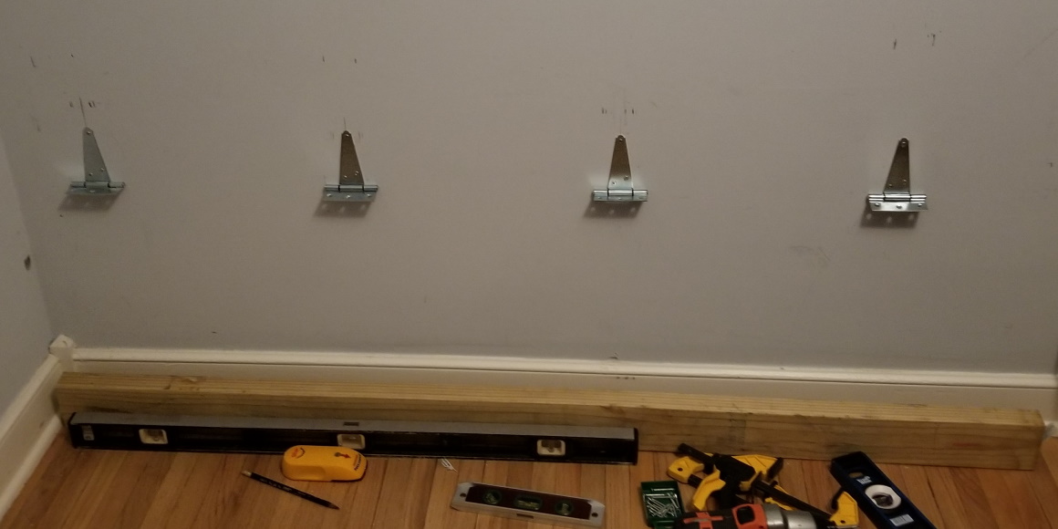 four hinges installed on wall